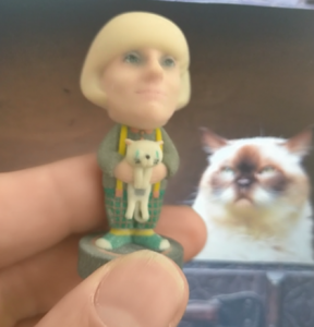 create your own 3d figurine holding a cat